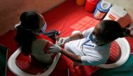Healthcare workers take part in a nationwide trial run of Covid-19 vaccine delivery systems on the outskirts of Ahmedabad, India, January 8, 2021. Reuters/Amit Dave
