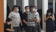 Family of a Sriwijaya Air passenger wait after Flight SJ182, with over 60 people on board, lost contact. Antara Foto/Jessica Helena Wuysang via Reuters