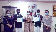 Students of DPS-MIS with their certificates obtained from quiz competition.