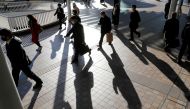Commuters wearing protective masks, amid the coronavirus disease (COVID-19) outbreak, make their way at Shinagawa station in Tokyo, Japan, January 8, 2021. REUTERS/Kim Kyung-Hoon