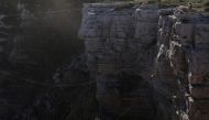 Adventure sport enthusiast Daisy Allen leaps from a cliff edge over the ocean while rope jumping near Currarong, Australia, January 9, 2021. Reuters/Loren Elliott