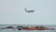 An Indonesian Military aircraft CN-235 is seen during the search and rescue operation for the Sriwijaya Air flight SJ 182, at the sea off the Jakarta coast, Indonesia, January 14, 2021 in this photo taken by Antara Foto. Antara Foto/M Risyal Hidayat/ via 