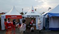Members of the Red Cross participate during the search and rescue operation for Sriwijaya Air flight SJ182, at Tanjung Priok port in Jakarta, Indonesia January 15, 2021. REUTERS/Willy Kurniawan