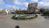 People ride on a motorbike along an empty road, as Lebanon tightened lockdown and introduced a 24-hour curfew to curb the spread of the coronavirus disease (COVID-19) in Sidon, Lebanon, January 15, 2021. REUTERS/Aziz Taher