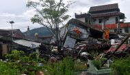 Search and rescue personnel inspect a collapsed building following an earthquake in Mamuju, West Sulawesi province, Indonesia, January 16, 2021. Sigid Kurniawan/Antara Foto via REUTERS/File Photo