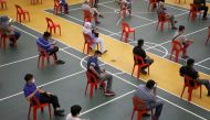 People wait to be tested for the coronavirus disease (COVID-19) in Petaling Jaya, Malaysia January 18, 2021. REUTERS/Lim Huey Teng