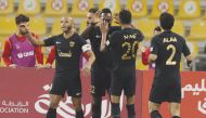 Al Rayyan's Yohan Boli (second left) celebrates with team-mates after scoring their second goal against Al Wakrah yesterday.