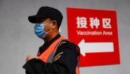 A man walks to receive a dose of a coronavirus disease (COVID-19) vaccine at a vaccination site, during a government-organized visit, in Beijing, China January 15, 2021. REUTERS/Carlos Garcia Rawlins