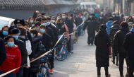 People line up to get their nucleic acid test following the outbreak of the coronavirus disease (COVID-19) in Beijing, China January 22, 2021. REUTERS/Carlos Garcia Rawlins
