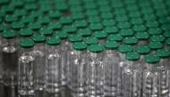 FILE PHOTO: Vials of AstraZeneca's Covishield coronavirus (COVID-19) vaccine, are seen before they are packaged inside a lab at Serum Institute of India, Pune, India, November 30, 2020. REUTERS/Francis Mascarenhas/File Photo
