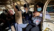 Passengers wearing masks and face shields for protection against the coronavirus disease (COVID-19) sit between plastic barriers inside a jeepney in Makati City, Metro Manila, Philippines, January 27, 2021. REUTERS/Eloisa Lopez