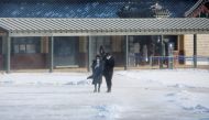 People take a walk on a cold winter day, amid the coronavirus disease (Covid-19) pandemic, at Gyeongbok Palace in central in Seoul, South Korea, January 28, 2021. REUTERS/Heo Ran