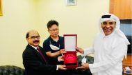 Sajed Jassim Mohammed Sulaiman, Vice-Chairman and Managing Director; C V Rappai, CEO & Director; and Harry Park, General Manager, LG Electronics Qatar, with the plaque of appreciation.