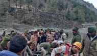 Members of Indo-Tibetan Border Police (ITBP) tend to people rescued after a Himalayan glacier broke and swept away a small hydroelectric dam, in Chormi village in Tapovan in the northern state of Uttarakhand, India, February 7, 2021. REUTERS/Stringer 