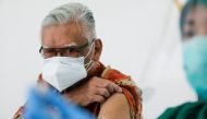 S. Parlindungan Gultom, a 76-year-old doctor, looks on as a medical worker prepares a dose of China's Sinovac Biotech vaccine for the coronavirus disease (COVID-19), as Indonesia approved use of the vaccine for its elderly population, in Jakarta, Indonesi