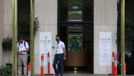 People depart a hotel where tennis players and personnel preparing for the Australian Open were tested for the coronavirus disease (COVID-19) following the news a quarantine hotel worker tested positive in Melbourne, Australia, February 4, 2021. REUTERS/L