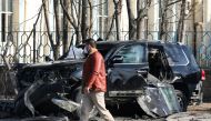 An Afghan security official inspects the site of a bomb blast in Kabul, Afghanistan February 9, 2021. Reuters/Omar Sobhani
