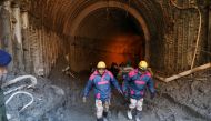 Members of a rescue team work inside a tunnel after a part of a glacier broke away in Tapovan, in the northern state of Uttarakhand, India, February 11, 2021. REUTERS/Anushree Fadnavis