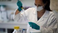 FILE PHOTO: A water quality scientist, conducts tests on a water sample at the Eau de Paris research and analysis laboratories in Ivry-sur-Seine, near Paris, France, July 22, 2020. REUTERS/Benoit Tessier