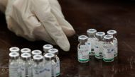 A health worker counts used vials of Sinopharm's coronavirus disease (COVID-19) vaccine, at a vaccination centre in Karachi, Pakistan February 11, 2021. REUTERS/Akhtar Soomro
