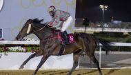 Zarandi, winner of Al Wajba Cup, crosses the finish line with jockey Ronan Thomas in the saddle.