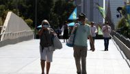 Fans are seen in Melbourne Park. It was announced the tournament will proceed without crowds over the next five days after the state of Victoria was placed under a snap lockdown from Friday to contain a fresh outbreak of the coronavirus disease (COVID-19)