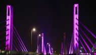 The cable-stayed bridge lit in purple to raise awareness about cancer.