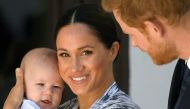 FILE PHOTO: Britain's Prince Harry and his wife Meghan, Duchess of Sussex, holding their son Archie in Cape Town, South Africa, September 25, 2019. REUTERS/Toby Melville/File Photo