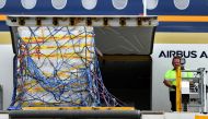 The first Australian shipment of Pfizer coronavirus disease (COVID-19) vaccines is unloaded from a Singapore Airlines plane at Sydney International Airport, Australia, February 15, 2021. AAP Image/Bianca De Marchi/via REUTERS 