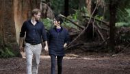 FILE PHOTO: Britain's Prince Harry and Meghan, Duchess of Sussex walk through a Redwoods forest in Rotorua, New Zealand, Wednesday, Oct. 31, 2018. Kirsty Wigglesworth/Pool via REUTERS/File Photo
