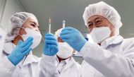 South Korean President Moon Jae-in inspects a LDS (low dead space) syringes plant in Gunsan, South Korea, February 18, 2021. Yonhap via REUTERS