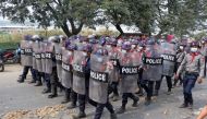 Police advance on the street during protests against the military coup, in Mandalay, Myanmar, February 20, 2021. REUTERS