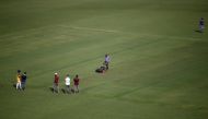 Groundsmen prepare a pitch at Sardar Patel Gujarat Stadium, where India and England are scheduled to play their third test match, in Ahmedabad, India, February 17, 2021. Reuters/Amit Dave