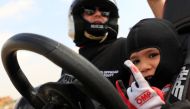 Egyptian Mansour Tarek, 5, son of international rally racer Tarek el-Erian, reacts after completing in a one-day racing event in Giza, Egypt February 20, 2021. Picture taken February 20, 2021. REUTERS/Amr Abdallah Dalsh