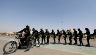 Special Security Unit (SSU) police members follow a motorbike as they rollerblade during practice along a road in Karachi, Pakistan February 19, 2021. Reuters/Akhtar Soomro