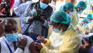 A health worker vaccinates a man against the coronavirus disease (COVID-19), in Harare, Zimbabwe, February 18, 2021. REUTERS/Philimon Bulawayo
