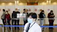 People queue up at a community vaccination centre to receive a dose of the Sinovac Biotech coronavirus disease (COVID-19) vaccine, in Hong Kong, China, February 26, 2021. REUTERS/Tyrone Siu