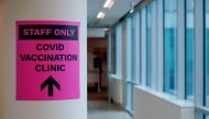 A sign for a COVID-19 vaccination clinic is seen as high-risk workers receive the first vaccines in the state of Victoria's rollout of the program, in Melbourne, Australia, February 22, 2021. REUTERS/Sandra Sanders