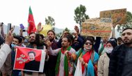 Supporters of the Pakistan Tehreek-e-Insaf (PTI) party chant slogans as they celebrate after Prime Minister Imran Khan won a vote of confidence from parliament, outside National Assembly building in Islamabad, Pakistan March 6, 2021. REUTERS/Salahuddin 