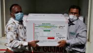 Officials unload boxes containing vials of AstraZeneca's Covishield, a coronavirus disease (COVID-19) vaccine manufactured by Serum Institute of India, outside a vaccination storage centre in Ahmedabad, India, January 12, 2021. Reuters/Amit Dave/File Phot
