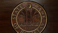 FILE PHOTO: The logo of the State Bank of Pakistan (SBP) is pictured on a reception desk at the head office in Karachi, Pakistan July 16, 2019. REUTERS/Akhtar Soomro/File Photo
