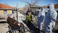 Health workers chat with Hakki Karakaya and his wife Ferdane Karakaya, an elderly couple living in Deliler village near Elmadag, after administering the Sinovac's CoronaVac COVID-19 vaccine at their home as nationwide vaccination continues for seniors, in