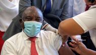 FILE PHOTO: South African President Cyril Ramaphosa receives the Johnson and Johnson coronavirus disease (COVID-19) vaccination at the Khayelitsha Hospital near CAPE TOWN, South Africa, February 17, 2021. Gianluigi Guercia/Pool via REUTERS//File Photo
