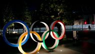 FILE PHOTO: The Olympic rings are illuminated in front of the National Stadium in Tokyo, Japan January 22, 2021. REUTERS/Kim Kyung-Hoon//File Photo