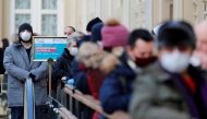 People line up to receive a dose of Sputnik V (Gam-COVID-Vac) vaccine against the coronavirus disease (COVID-19) at a vaccination centre in the State Department Store, GUM, in central Moscow, Russia January 18, 2021 REUTERS/Shamil Zhumatov/File Photo