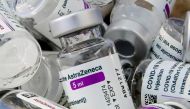 Empty vials of Oxford/AstraZeneca's COVID-19 vaccine are pictured amid a vaccination campaign in Bierset, Belgium March 17, 2021. REUTERS/Yves Herman/File Photo