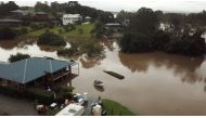 People move their belongings during floods after heavy rainfall in Tinonee, New South Wales, Australia March 20, 2021, in this still image taken from drone video obtained from social media. Simmi Valgeirsson / Reuters