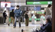 People sit on the floor at a station as train services are suspended following an earthquake in Sendai, Miyagi prefecture, Japan in this photo taken by Kyodo on March 20, 2021.  Kyodo
