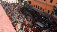Naga Sadhus, or Hindu holy men, leave the banks of the Ganges river after the first Shahi Snan at 