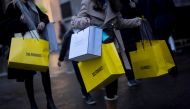 FILE PHOTO: shoppers walk down Oxford Street, amid the coronavirus disease (COVID-19) outbreak in London, Britain, December 13, 2020. REUTERS/Simon Dawson/File Photo
